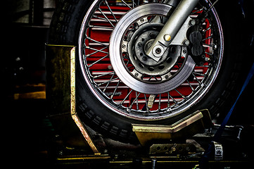 Image showing motorcycle wheel in holder