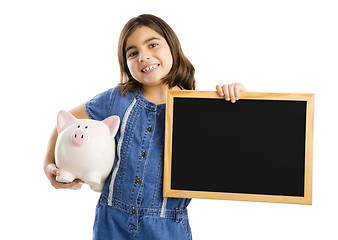 Image showing Girl holding a piggybank