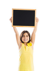 Image showing Girl holding a chalkboard