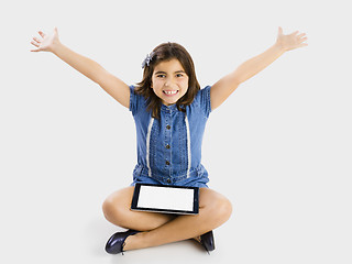 Image showing Young girl using a tablet