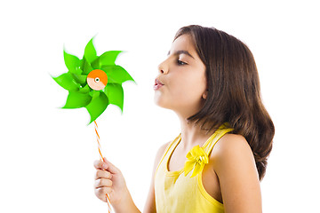 Image showing Girl blowing a windmill