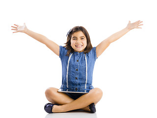 Image showing Young girl using a tablet