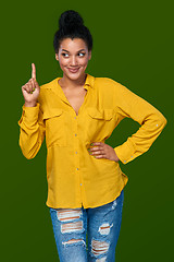 Image showing Woman pointing her finger up