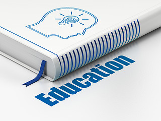 Image showing Studying concept: book Head With Lightbulb, Education on white background