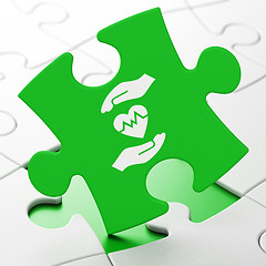 Image showing Insurance concept: Heart And Palm on puzzle background