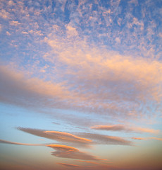 Image showing sunrise in the colored sky white soft clouds 