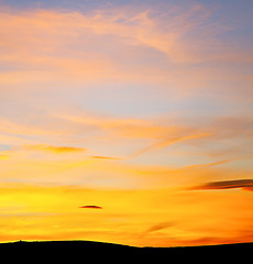 Image showing sunrise in the colored sky white soft clouds and abstract backgr