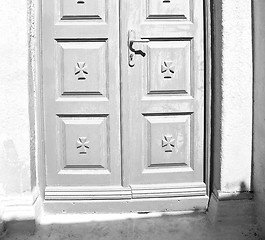 Image showing white  red brown  door in antique village santorini greece europ