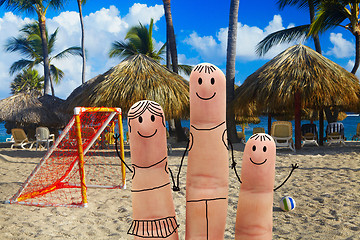 Image showing Happy family on the beach. Beachfront football