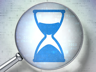 Image showing Time concept: Hourglass with optical glass on digital background