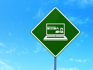 Image showing News concept: Breaking News On Laptop on road sign background