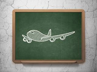 Image showing Vacation concept: Airplane on chalkboard background