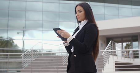 Image showing Stylish businesswoman using her tablet