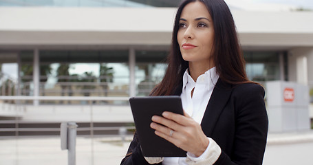 Image showing Young contemplative businesswoman