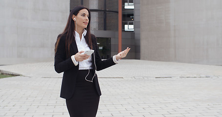 Image showing Young businesswoman talking on her mobile