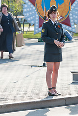 Image showing Young policewoman - sergeant protects an order
