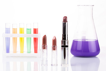 Image showing chemical test tubes and lipstick. harmful cosmetics.