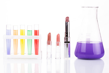 Image showing chemical test tubes and lipstick. harmful cosmetics.