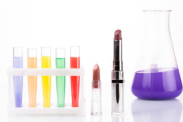 Image showing chemical test tubes and lipstick. harmful cosmetics.