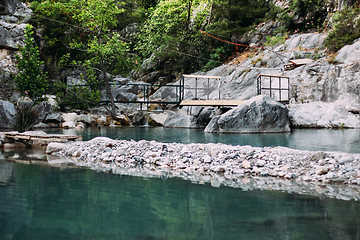 Image showing Empty zipline in the mountains near lake