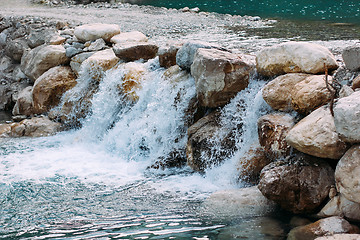 Image showing The road passes through a waterfall