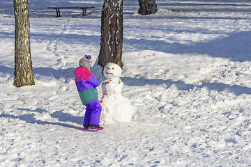Image showing Child make snowmen