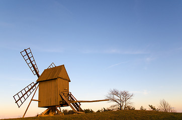 Image showing Sunlit old traditional windmill