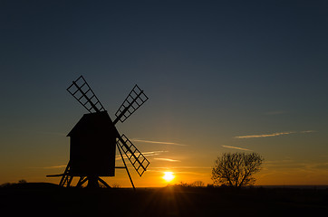 Image showing Sunset with silhouette of an old windmill