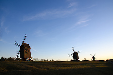 Image showing Old windmills in a row