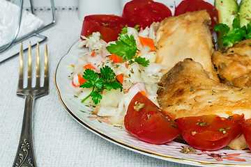 Image showing Baked fish and vegetables on the plate.