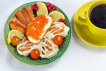 Image showing Snacks with fish and black coffee.