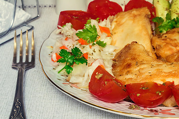 Image showing Baked fish and vegetables on the plate.