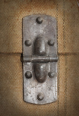Image showing Old canvas trunk hinge close up