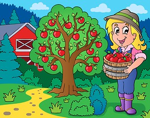 Image showing Farm girl with collected apples