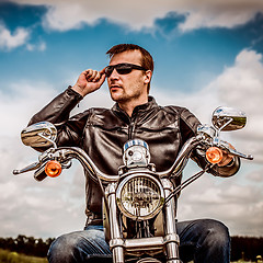 Image showing Biker on a motorcycle