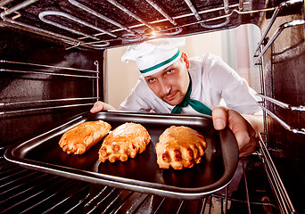 Image showing Chef cooking in the oven.