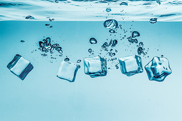 Image showing Ice cubes falling under water