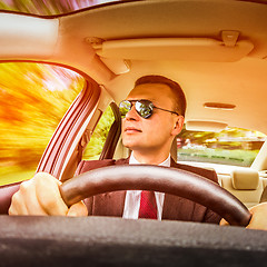 Image showing Man driving a car.