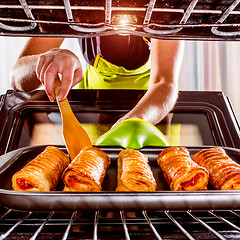 Image showing Cooking in the oven at home.