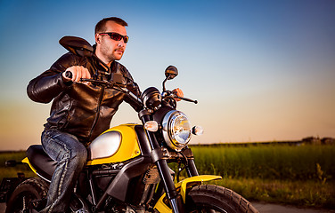 Image showing Biker on a motorcycle