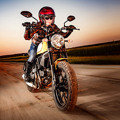 Image showing Biker girl on a motorcycle