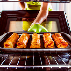 Image showing Cooking in the oven at home.