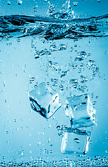 Image showing Ice cubes falling under water