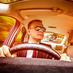 Image showing Man driving a car.