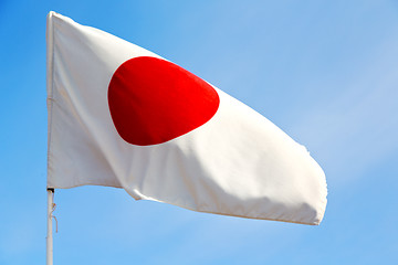Image showing japanb waving flag in the  sky   and wave