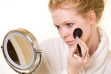 Image showing Woman looking in mirror