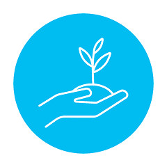 Image showing Hands holding seedling in soil line icon.