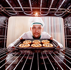 Image showing Chef cooking in the oven.