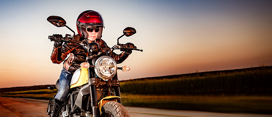 Image showing Biker girl on a motorcycle