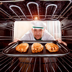 Image showing Chef cooking in the oven.